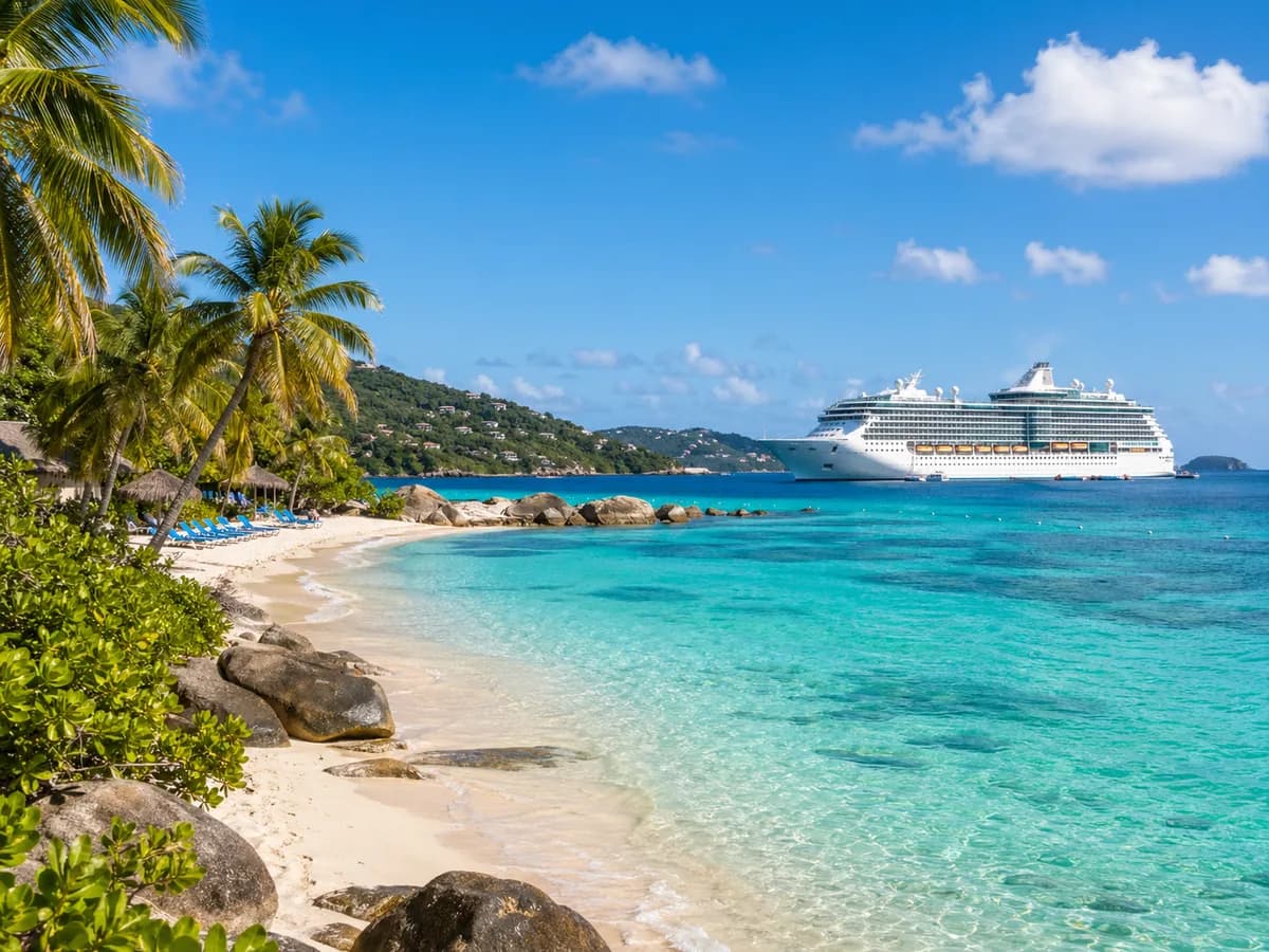 Western Caribbean island beach with a cruise ship offshore